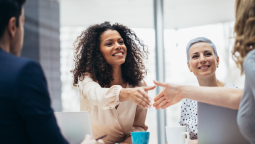 Healthcare professionals, three ladies and a man holding a collaboration session