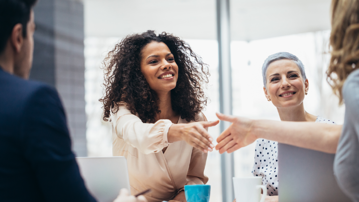 Healthcare professionals, three ladies and a man holding a collaboration session