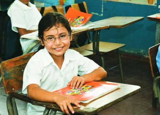Kid with glasses in class